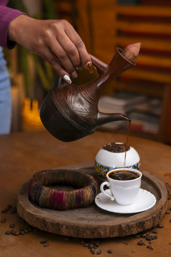 Coffee being poured from a traditional jebena (stock photo, not taken at Habesha)